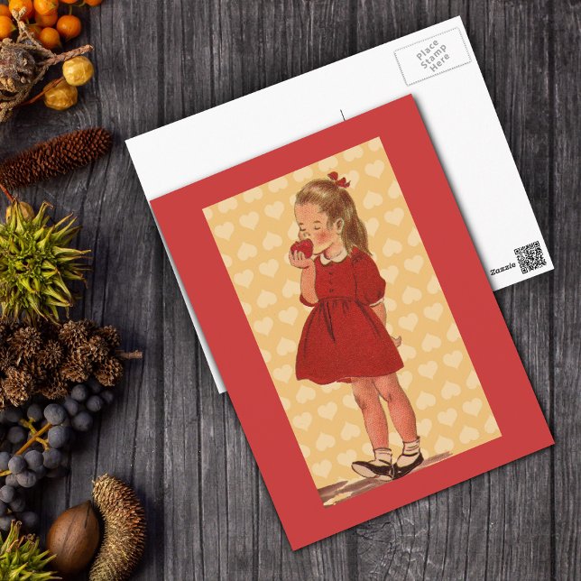 Sweet Little Girl With Apple Postcard (Vintage Little girl red dress eating apple on yellow hearts with bright red border on postcard.)