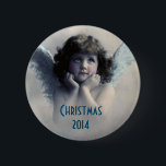 Sweet Vintage Angel Christmas Memento 6 Cm Round Badge<br><div class="desc">A nice christmas memento. Beautiful vintage design of a sweet Christmas angel with soft white wings and rosy cheeks, holding her face in her hands. Looking peaceful and kind. The background is filled with soft ethereal clouds. Text says Christmas 2014 and you can customise / personalise / delete the text,...</div>