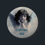 Sweet Vintage Angel Christmas Memento 6 Cm Round Badge<br><div class="desc">A nice christmas memento. Beautiful vintage design of a sweet Christmas angel with soft white wings and rosy cheeks, holding her face in her hands. Looking peaceful and kind. The background is filled with soft ethereal clouds. Text says Christmas 2014 and you can customise / personalise / delete the text,...</div>