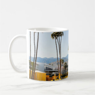 Swimming pool near palm trees in the morning coffee mug