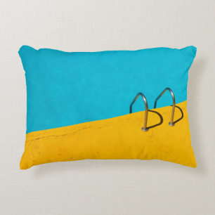 Swimming pool with stainless steel ladder decorative cushion