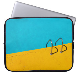 Swimming pool with stainless steel ladder laptop sleeve