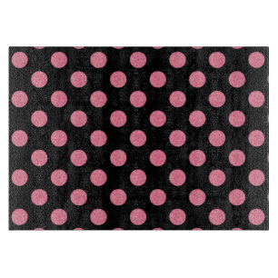 Swirly pink polka dots on black background cutting board