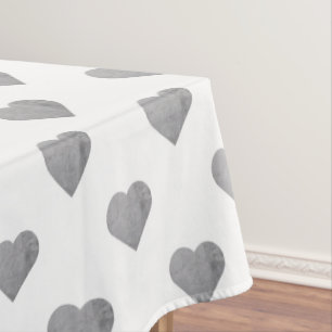Symmetric Small Concrete Grey Hearts on White Tablecloth