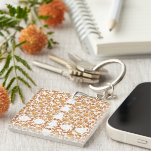 Symmetrical floral pattern with orange motifs rese key ring