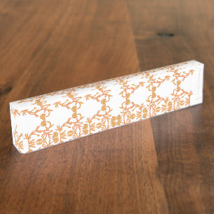Symmetrical floral pattern with orange motifs rese nameplate