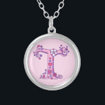 T monogram decorative letter necklace<br><div class="desc">Pretty letter T monogram pendant. Whimsical letter drawing of the capital initial letter T ideal for gifting girls with a name that begins with T. Background colour can be changed if required,  currently light pink. © Original drawing and design by Sarah Trett www.sarahtrett.com for www.mylittleeden.com</div>