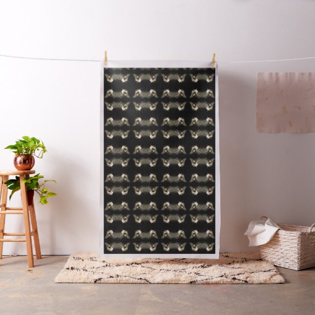Tabby Cat With Green Eyes Isolated On Black Fabric (In Situ)