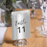 Table Nuber Silver Grey Grey Drips Black Sparkly Table Number<br><div class="desc">The Zazzle Table Number Silver Grey with Grey Drips and Black Sparkly background is a stunning piece of decor that adds an element of sophisticated glamour to any event setting. Perfect for weddings, galas, or any formal gathering, this table number card combines elegance with a modern twist. Featuring a sleek...</div>