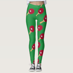 Table tennis racket and ball on green leggings