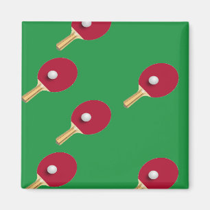 Table tennis racket and ball on green magnet