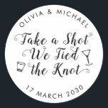 Take A Shot Tied the Knot Wedding Drink Favour Classic Round Sticker<br><div class="desc">A Classic Black Thank You Wedding Favour Label Sticker featuring "Take a Shot We Tied the Knot" in a rustic modern elegant font calligraphy. 
You can easily personalised it with your names and wedding date.</div>