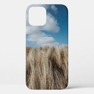 Tall grass under cumulus clouds iPhone 12 case