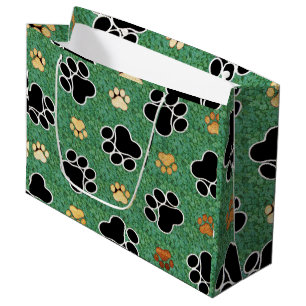Tan and black paw print on green grass large gift bag