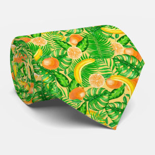 Tangerines, bananas and tropical leaves tie