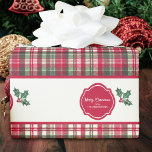Tartan pattern and holly personalised christmas  wrapping paper<br><div class="desc">This very elegant and traditional Christmas wrapping paper is decorated with lines of warming tartan pattern combining red, white and green stripes And white lines featuring a badge with the message merry Christmas with the sender’s name and a subtle holly flower over a white background. To make every Christmas present...</div>