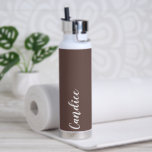 Taupe Personalised Wedding Bridesmaid Water Bottle<br><div class="desc">Gift your wedding bridesmaid or maid of honour with this trendy, vacuum Insulated water bottle that features her name in white, stylised script on a taupe colour background designed to match your wedding colour scheme. Personalise bottle by editing and replacing name with your own as desired. Select your water bottle...</div>