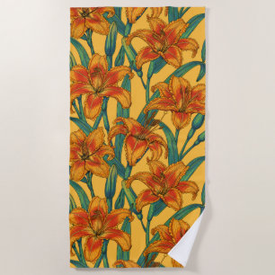 Tawny daylily flowers, blue and yellow beach towel