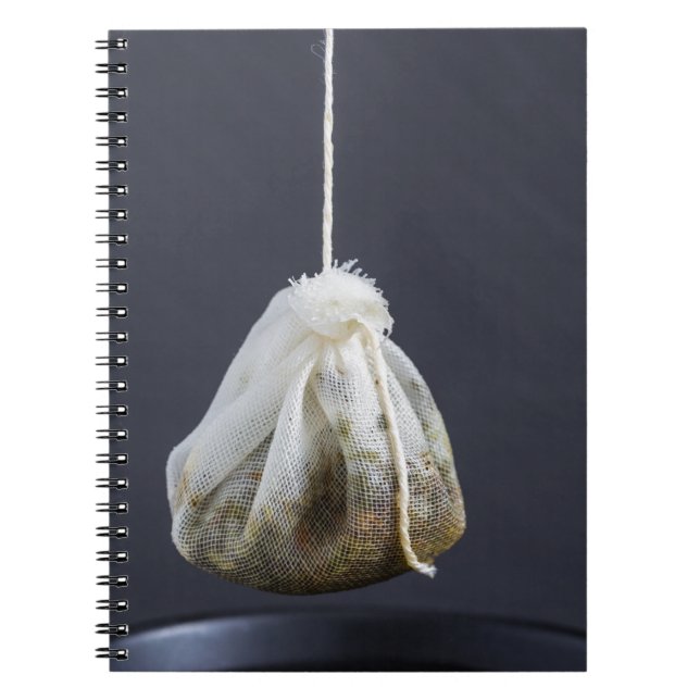 Tea bag is hung in a cup notebook (Front)