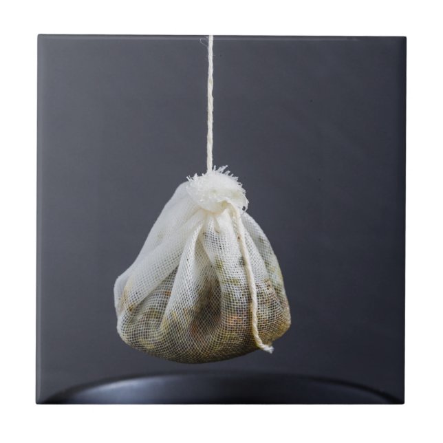 Tea bag is hung in a cup tile (Front)
