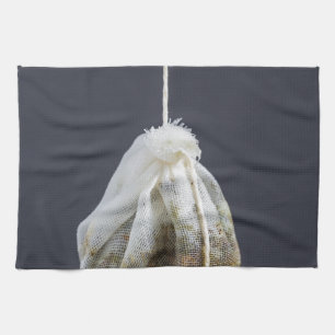 Tea bag is hung in a cup towel