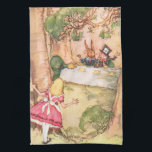 Tea Party 4 Towel<br><div class="desc">16” x 24” kitchen towel with a vintage Alice in Wonderland image of Alice peering from behind a tree at a Mad Hatter's tea party in progress with the Mad Hatter, March Hare, and Dormouse, by artist A. H. Watson (1939). See the entire Wonderland Kitchen Towel collection in the FOOD/BEV...</div>