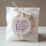 Teacher gift watercolor heart classic round sticker<br><div class="desc">Teaching its a work of heart personalised teacher gift. With hand lettered script,  a pink watercolor heart and space for their name. The perfect end of year or holiday gift for your favourite teacher.</div>