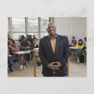 Teacher in classroom with students postcard