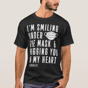 Teacher Smiling Under Mask Hugging In Heart T-Shirt