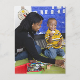 Teacher with toddler in daycare postcard