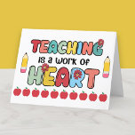 Teaching Work of Heart Teacher Appreciation Thank You Card<br><div class="desc">Say thank you in the sweetest way with this folded teacher appreciation card featuring the heartfelt message: Teaching Is a Work of Heart. Designed with bold, colourful lettering, cheerful flowers, bright yellow pencils, and a row of classic red apples, this card is perfect for teachers who bring energy, kindness, and...</div>