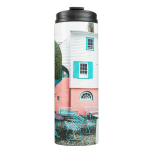 TEAL AND GRAY TABLE AND BENCH BESIDE WHITE AND ORA THERMAL TUMBLER