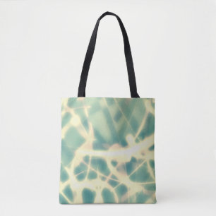 Teal and webs made of light on a tote bag