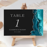 Teal Blue Agate Silver Dark Wedding Table Number<br><div class="desc">The right-hand edge of this elegant modern wedding table number card features a teal blue watercolor agate border trimmed with faux silver glitter. The customisable text combines silver grey Roman serif,  italic and copperplate fonts on an off-black background.</div>