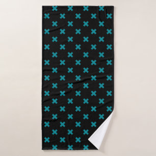 Teal cross stitches on black bath towel