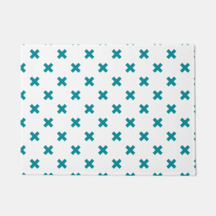 Teal cross stitches on white doormat