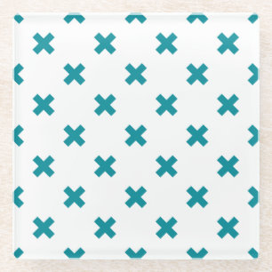 Teal cross stitches on white glass coaster