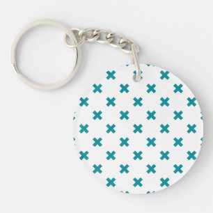 Teal cross stitches on white key ring