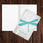 Teal Dragonfly Personalised Planner<br><div class="desc">Keep track of reminders and important appointments with a Teal Dragonfly Personalised Planner. Planner design features a colourful dragonfly, a soft white leafy vine against a light grey grunge damask background with an area to personalise with your name. Additional gift items available with this design as well as a variety...</div>