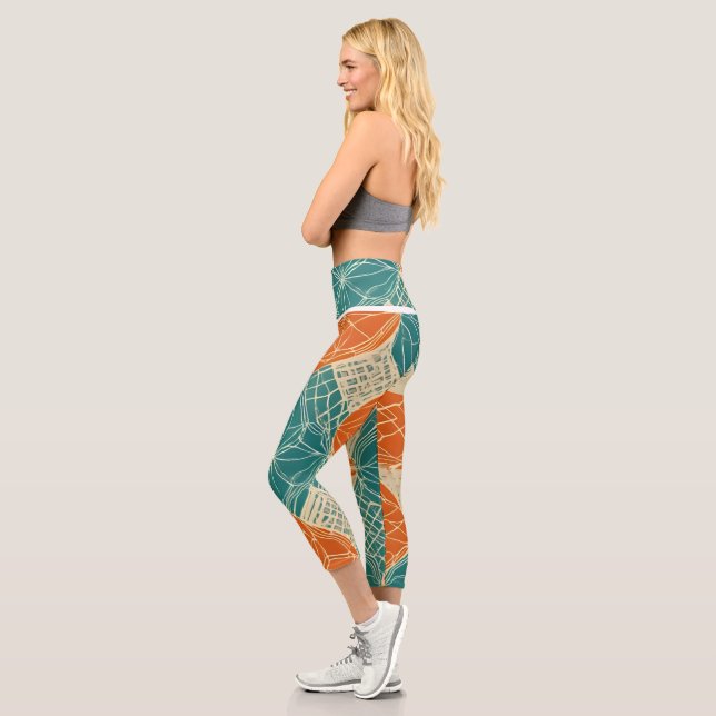 Teal, Orange, and Tan Abstract Flowers  Capri Leggings (Left)