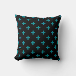 Teal polka crosses on black cushion