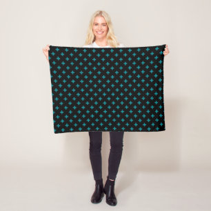 Teal polka crosses on black fleece blanket