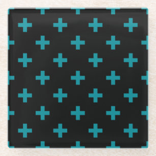 Teal polka crosses on black glass coaster
