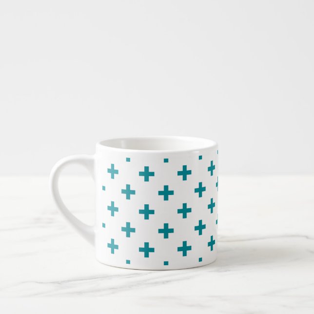 Teal polka crosses on white espresso cup (Left)