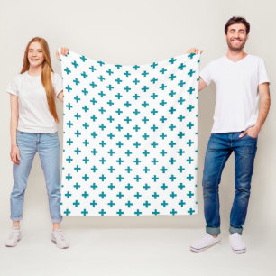 Teal polka crosses on white fleece blanket