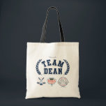 Team Dean Gilmore Girls Design Tote Bag<br><div class="desc">Show your support for Rory’s first love with this Team Dean design from Gilmore Girls! Featuring bold varsity lettering flanked by laurel branches, this fan-favourite artwork includes nods to Dean’s world: crossed hockey sticks, Doose’s Market, his signature pickup truck, and the unforgettable quote “I love you, you idiot.” A must-have...</div>