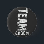 Team Groom Extra Large Grunge Text 6 Cm Round Badge<br><div class="desc">Extra large "grunge" looking text reads: "Team Groom". This design is ideal for a Bachelor Party outing! Don’t forget the matching “Team Bride” designs. Copy and paste this text into your browser window to view these designs: http://www.zazzle.com/exclusivelyweddings*/gifts?cg=196481553580698855</div>