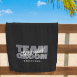 Team Groom Groomsman Wedding Cool Retro Black Pool Beach Towel<br><div class="desc">Custom beach towel design for your groomsmen features "TEAM GROOM" in bold light grey type on a solid black background. Customise groomsman's name in crisp white script. Title or custom text is featured below. All colours in this design are customisable in the Zazzle design tool area! Message with questions or...</div>
