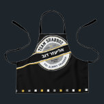 Team Shabbos Kid's Apron on Black with Hebrew<br><div class="desc">Our TREAM SHABBOS Apron on Black is a cool way to get everyone on board with Shabbos prep. Get one for every member of the team and watch them pitch in! ALL text on this branded look can be customised. Practical & fun... Just like your family. Includes the words: TGI...</div>