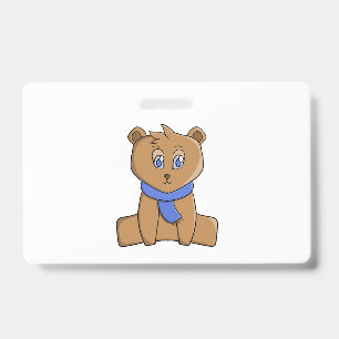 Teddy bear wearing a blue scarf ID badge